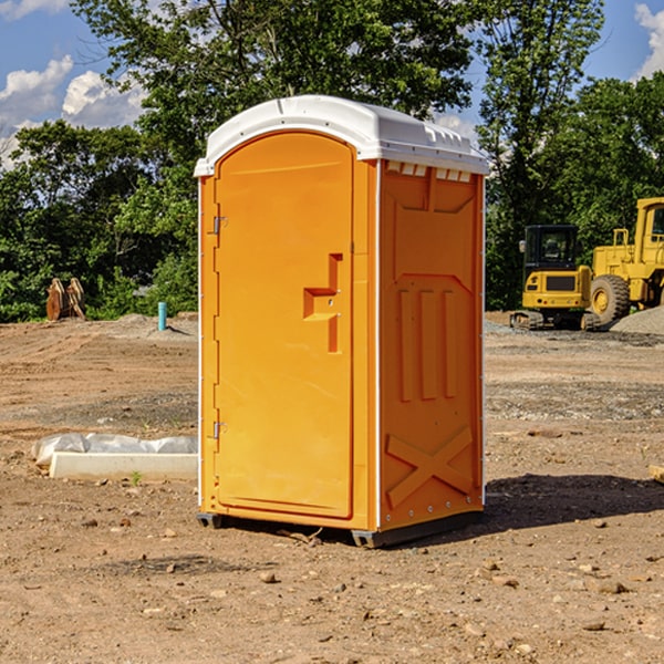 how often are the portable restrooms cleaned and serviced during a rental period in Powers Lake